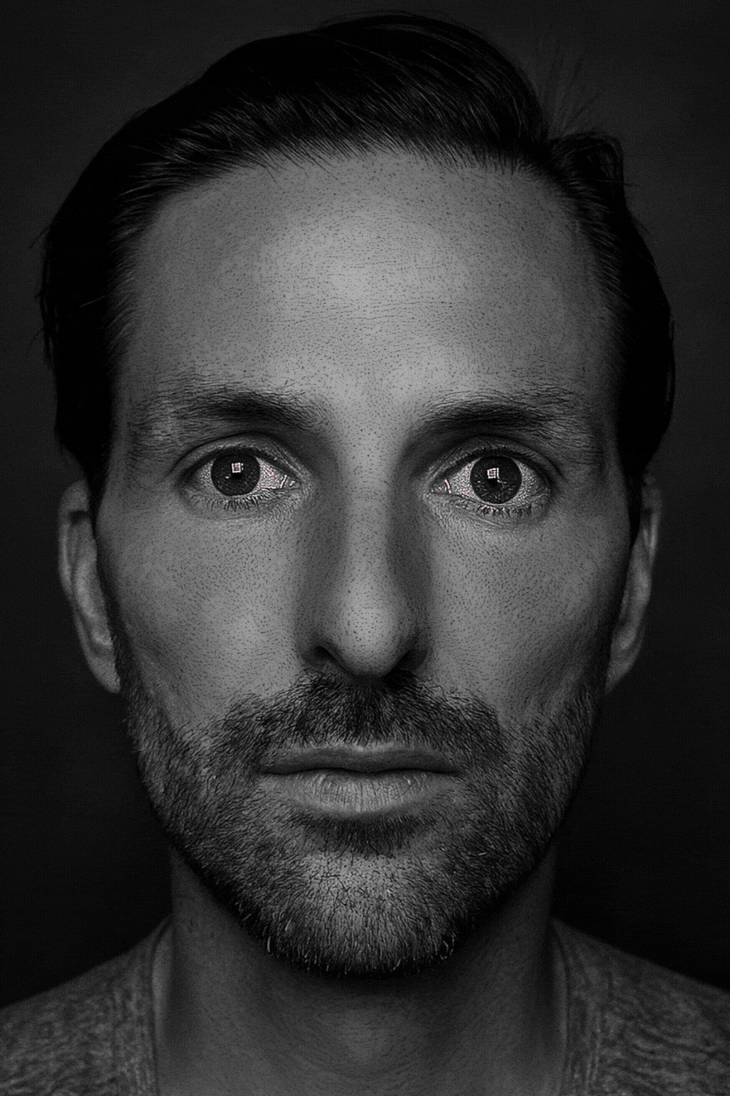 Seth Jennemann MEFREEK Self-Portrait Photo - Neon IDONTFEELANDIFEELGREAT contemporary photographic self-portrait pop art style with glowing pink neon text across intense grayscale face gif