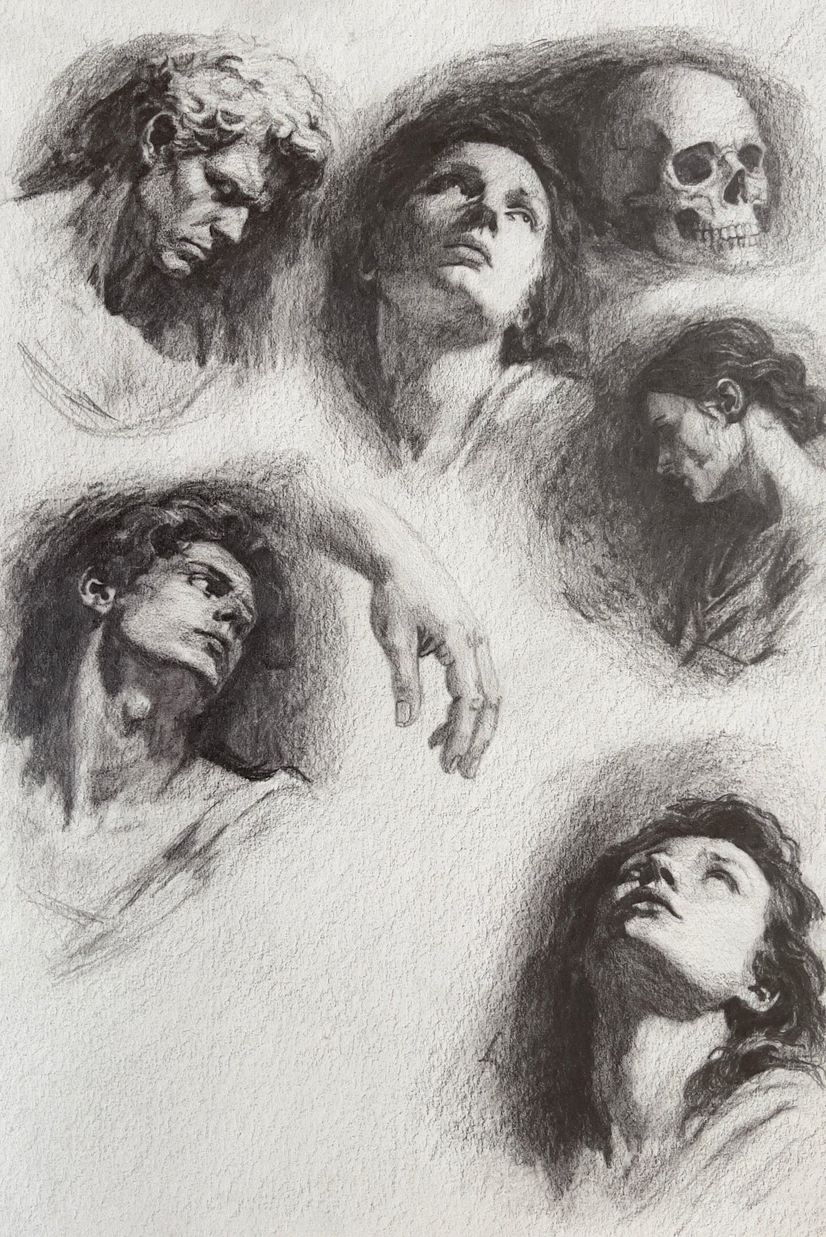 MEFREEK Seth Jennemann Graphite Pencil Drawing collection of classical head studies featuring expressive faces a skull and dramatic lighting exploring emotion anatomy and shadow on textured paper
