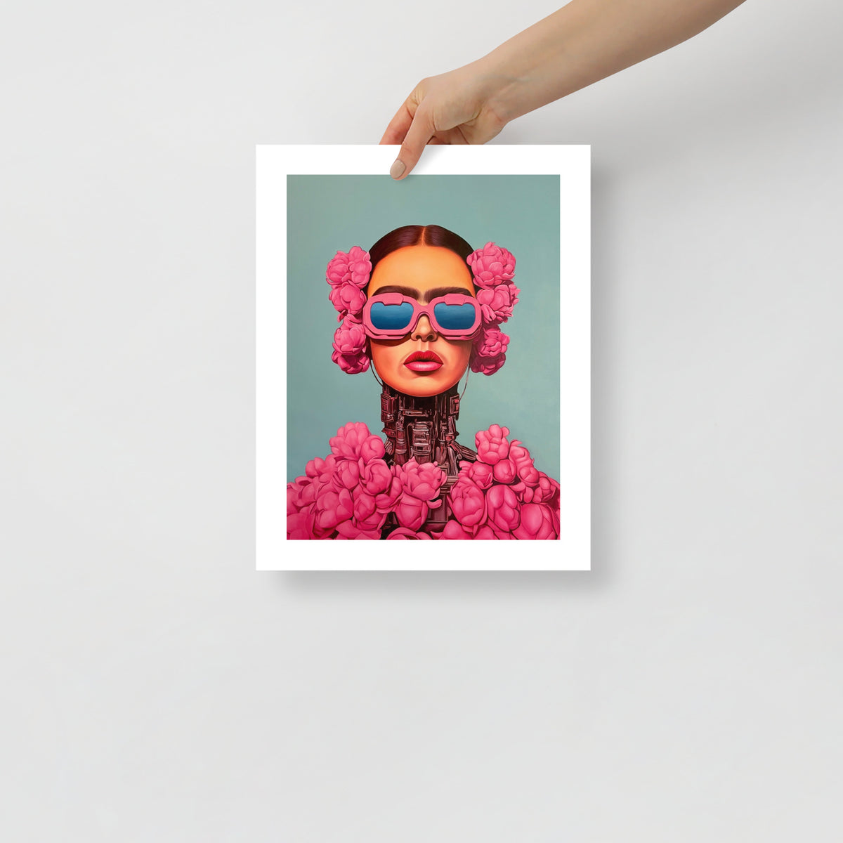 MEFREEK Seth Jennemann Open Edition Print “Identity Program” — vivid fine art print of a cybernetic woman surrounded by pink flowers and wearing glossy pink glasses, displayed unframed as a person holds the artwork for scale.