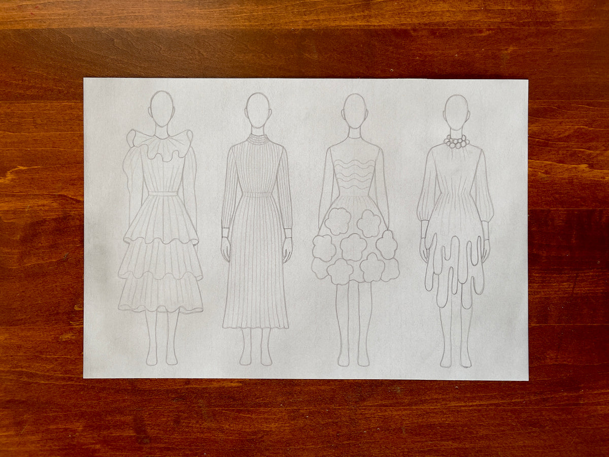 Seth Jennemann MEFREEK I Just Want To Be Me – pencil drawing in a minimalist fashion croquis style showing four faceless figures in distinct creative dress designs, including ruffled, pleated, floral, and dripped silhouettes on plain white paper.
