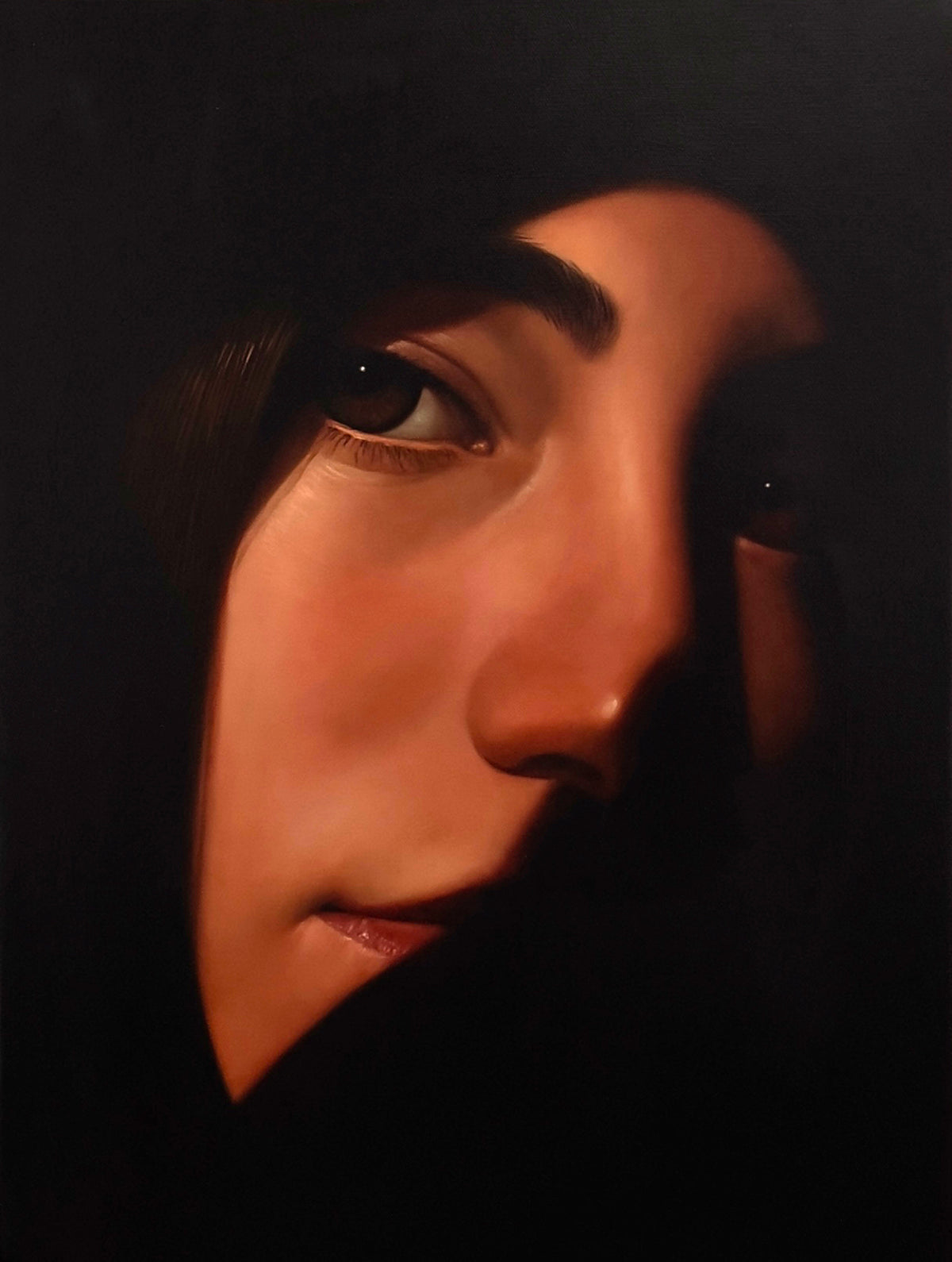 MEFREEK Seth Jennemann Original Oil Painting "Indoor Thoughts With The Windows Down" depicting a photorealistic portrait of a dark-haired woman whose face emerges diagonally from a nearly black background. Warm copper and amber tones illuminate one side of her face, highlighting her expressive brown eye, softly defined cheekbones, nose, and natural lips, while her other eye disappears into shadow. Deep black negative space surrounds the portrait, emphasizing the striking contrast between light and darkness 