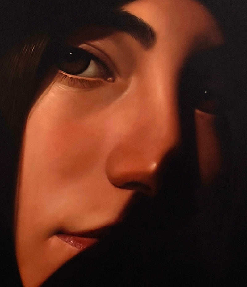 MEFREEK Seth Jennemann Original Oil Painting "Indoor Thoughts With The Windows Down" featuring an extreme close-up portrait of a dark-haired woman with warm, luminous skin emerging from deep black shadows. One brown eye is sharply illuminated while the other remains partially concealed in darkness. Soft amber lighting reveals her sculpted nose, defined eyebrow, delicate eyelashes, and slightly parted glossy lips. The hyperrealistic composition uses dramatic chiaroscuro lighting to create a mysterious, intim