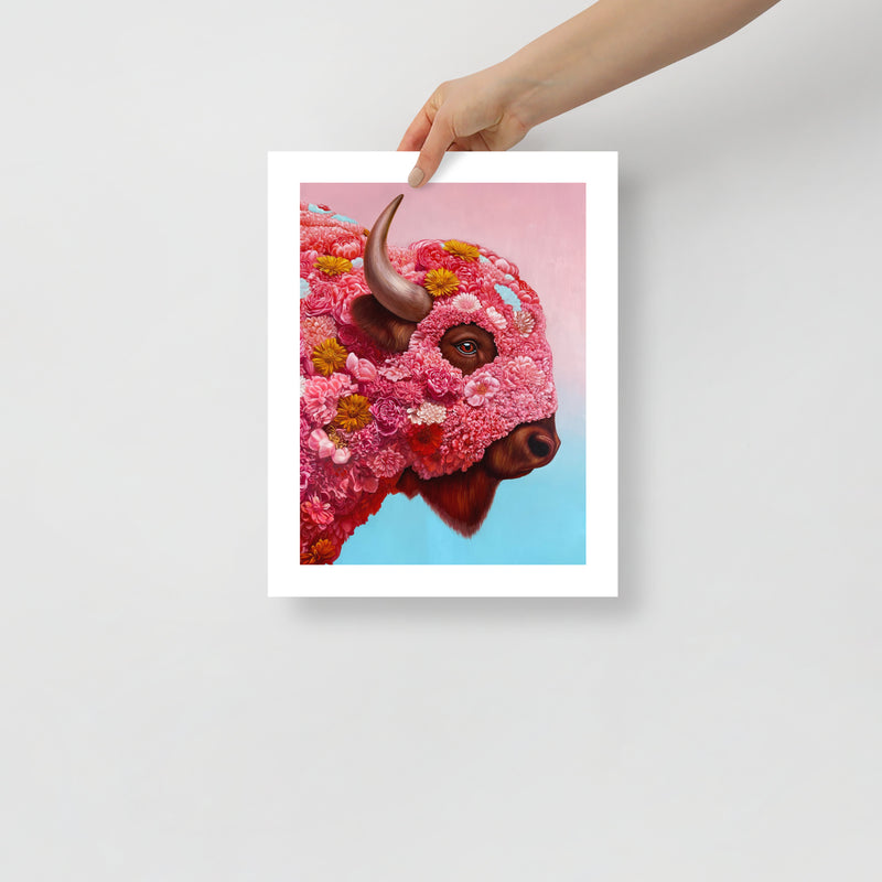 MEFREEK Seth Jennemann Open Edition Print hyper realistic floral bison portrait with intricate pink blossoms forming the animal’s face, detailed horn and expressive eye, shown as a physical fine art print held by a hand against a clean minimal background