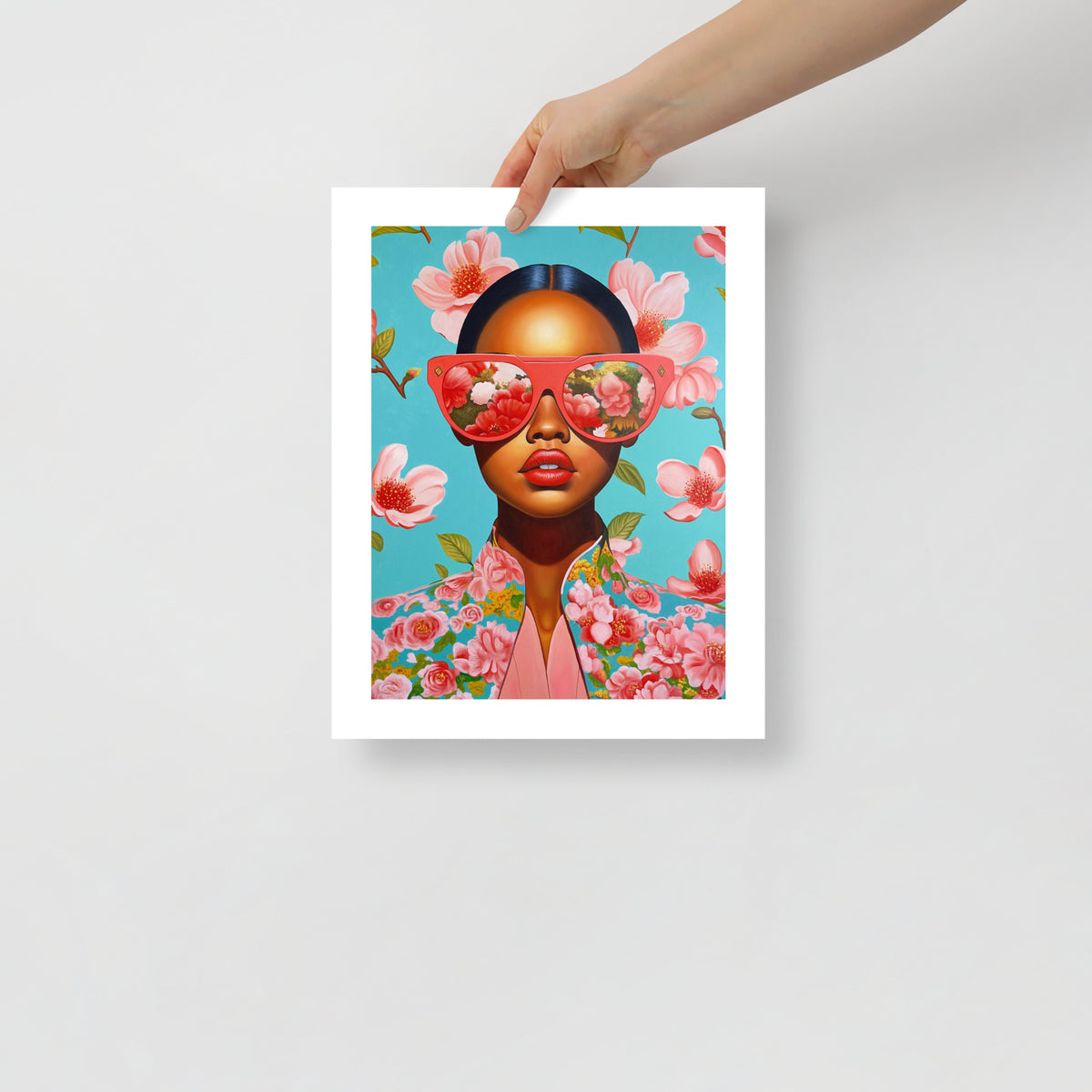 MEFREEK Seth Jennemann Open Edition Print Now With Less Feeling being held; detailed oil painting of a woman in coral glasses and floral jacket, surrounded by blossoms on aqua backdrop, fine-art print with vivid color saturation and clean white border.