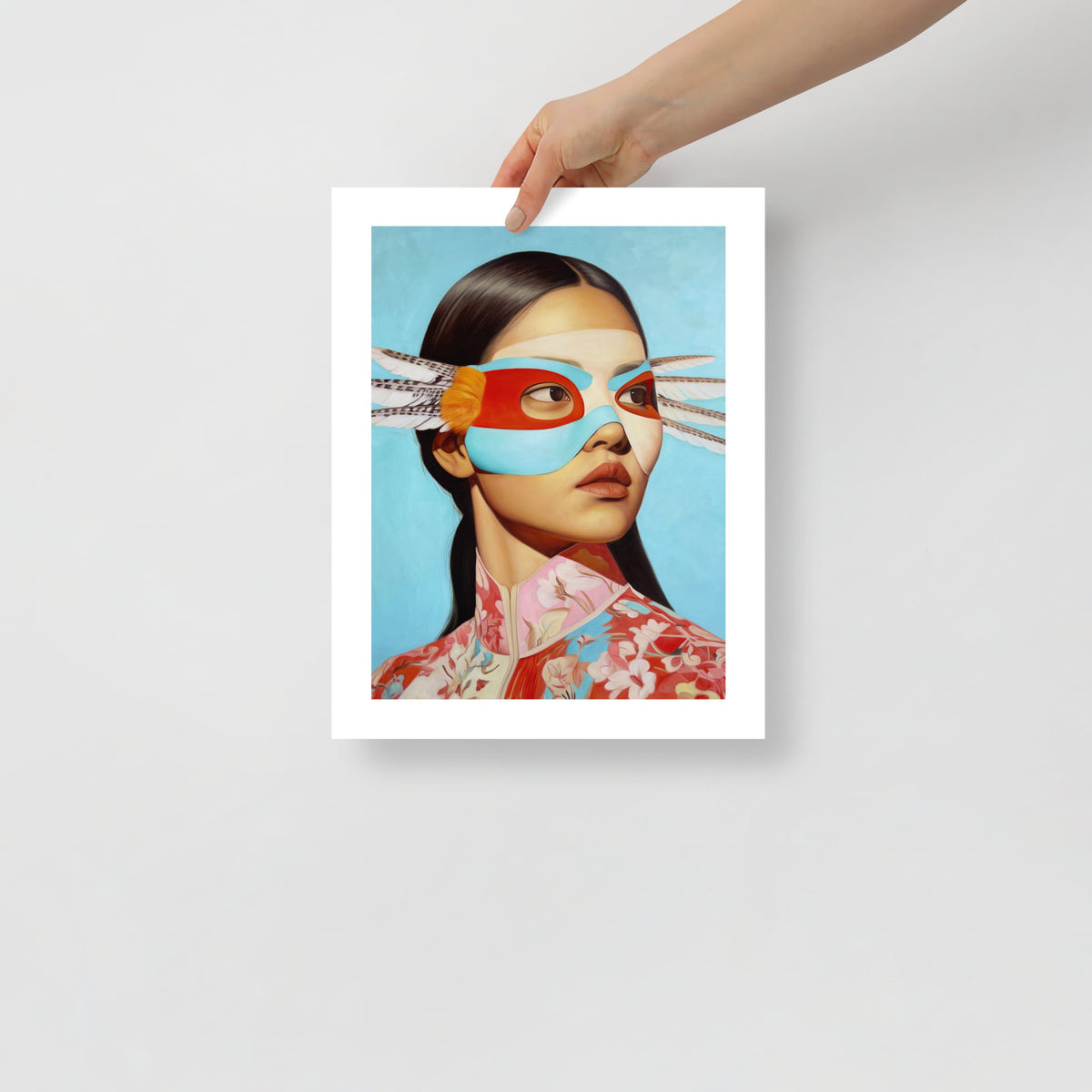 MEFREEK Seth Jennemann Open Edition Print She Likes It Better Wrong being held; vivid hyperreal portrait featuring red, turquoise, and cream mask details, floral patterned attire, and smooth gradient background in a minimalist composition.