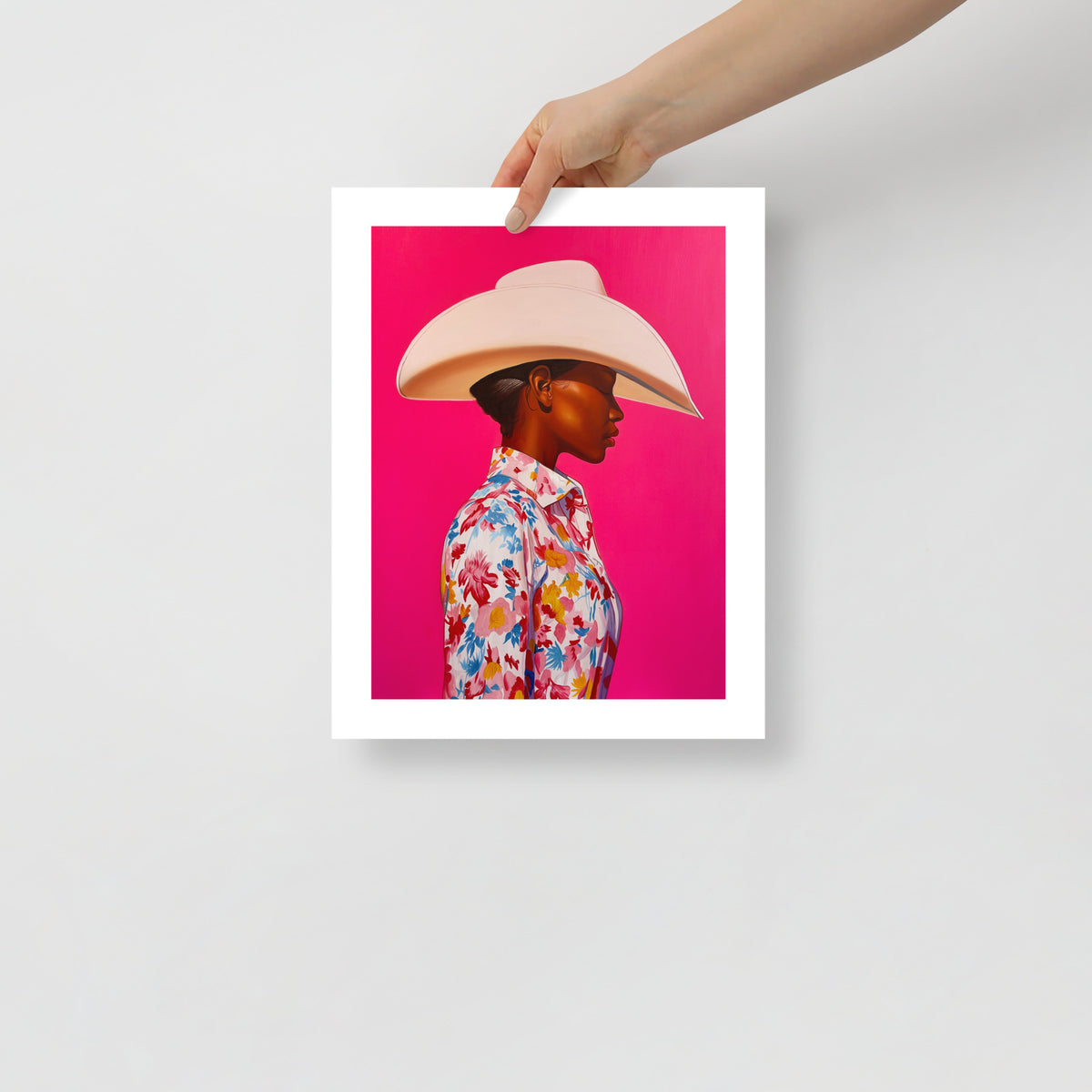 MEFREEK Seth Jennemann Open Edition Print The Milk Tastes Funny When You’re On The Carton shows a hyperreal side-profile of a woman in a cream cowboy hat and colorful floral blouse set against a saturated pink backdrop. The smooth lighting, crisp texture, and polished realism reflect MEFREEK’s distinct mix of humor and emotional unease.