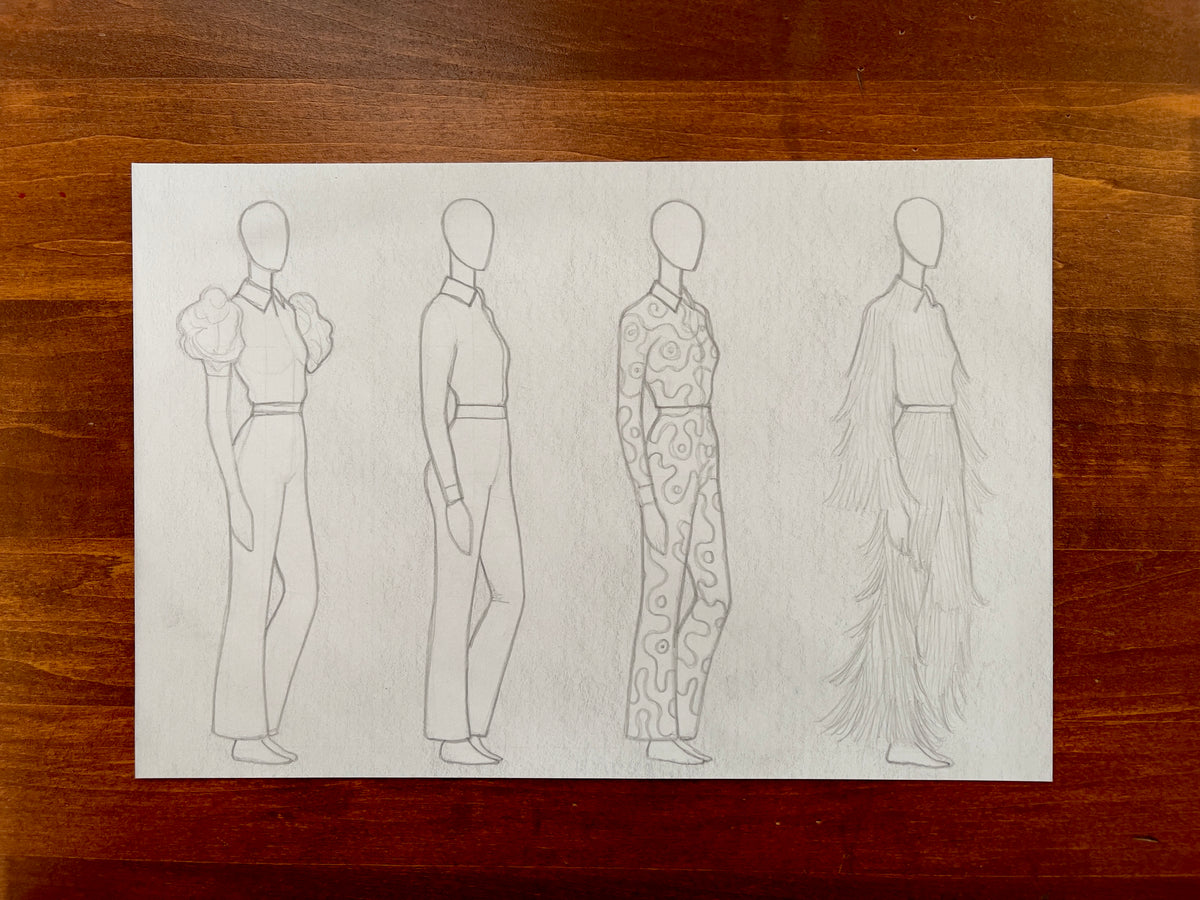 Seth Jennemann MEFREEK – “The Dirt Settled And So Did We” – pencil drawing, fashion croquis concept art in contemporary surreal style. Four faceless figures in progressive design variations, featuring puff sleeves, fitted tailoring, abstract pattern suit, and cascading fringe costume on a white sheet over a wood surface.
