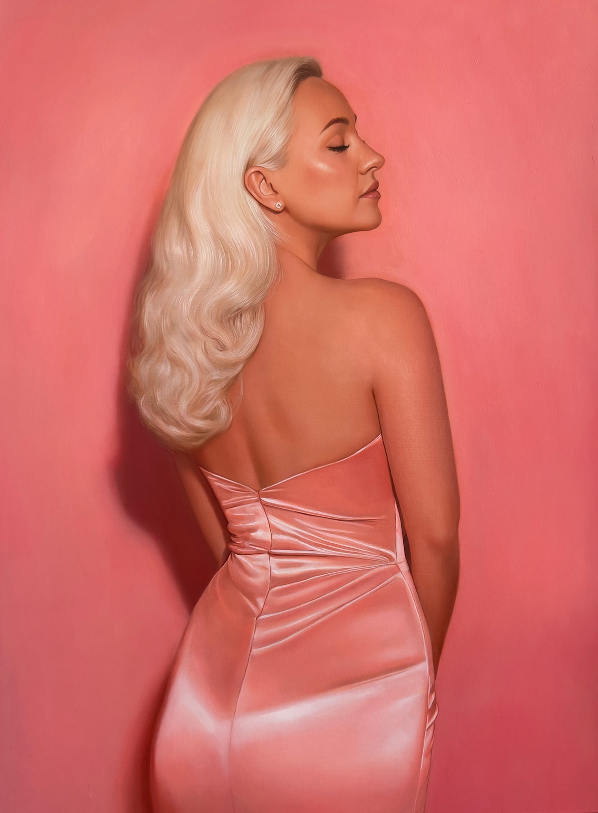 MEFREEK Seth Jennemann Original Oil Painting "Two For The Price Of Two" depicting a glamorous blonde woman viewed from behind in a form-fitting, backless pink satin dress. Her long platinum blonde hair cascades in soft vintage-inspired waves as she turns her face to the side with her eyes closed. The realistic portrait features luminous skin tones, detailed satin folds, and a monochromatic coral pink background.