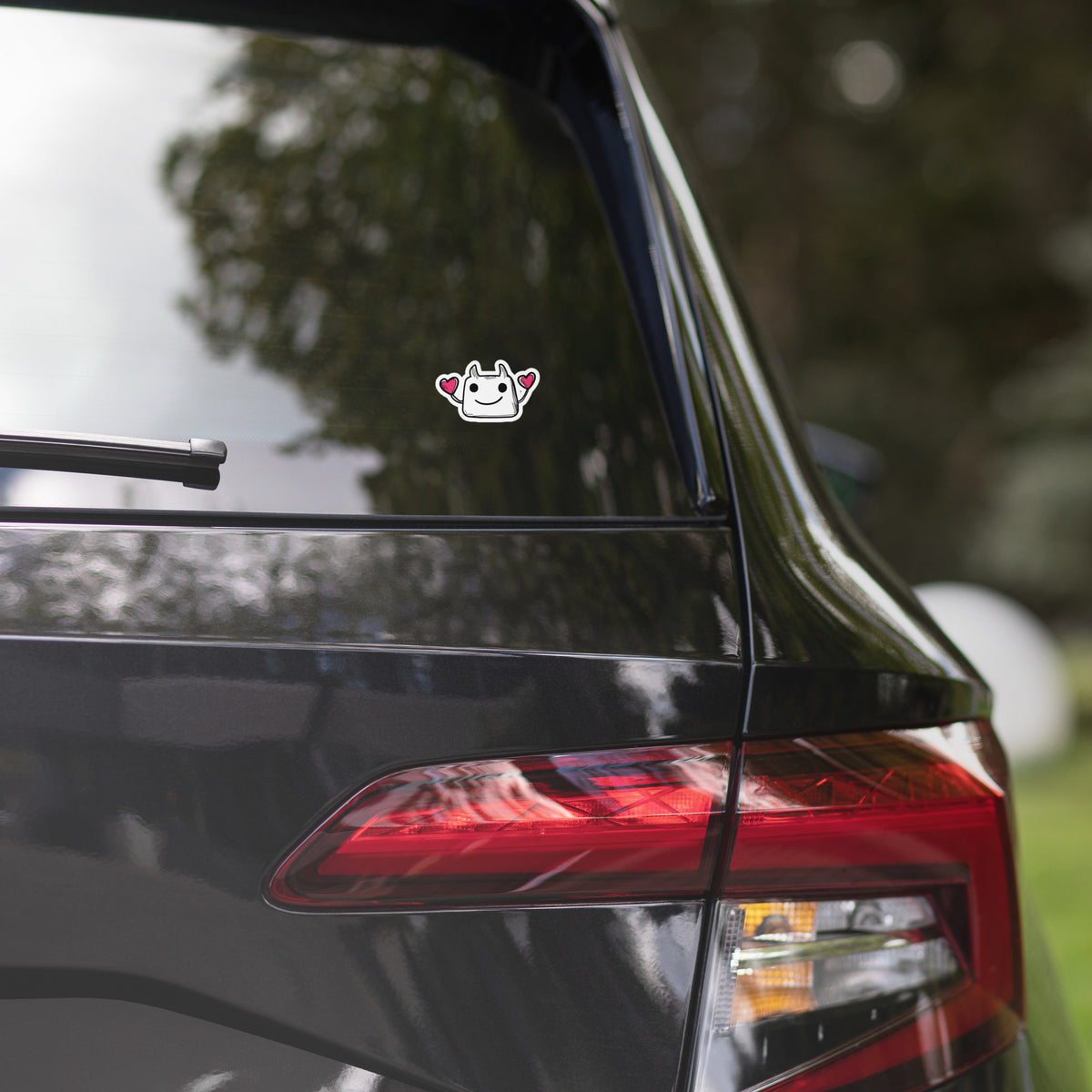 Car sticker with wolf design on a vehicle's rear window