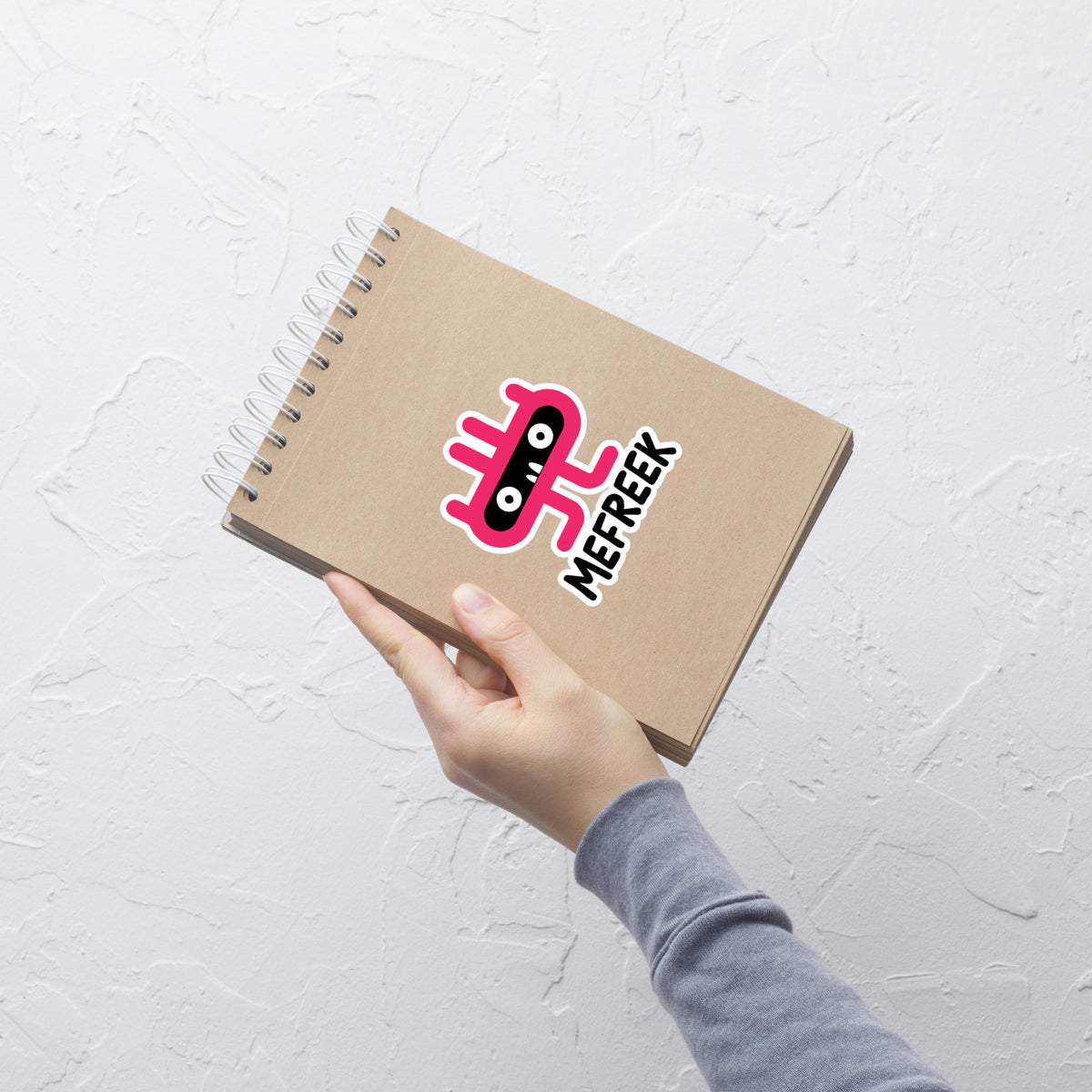 Notebook with a logo on a white textured background