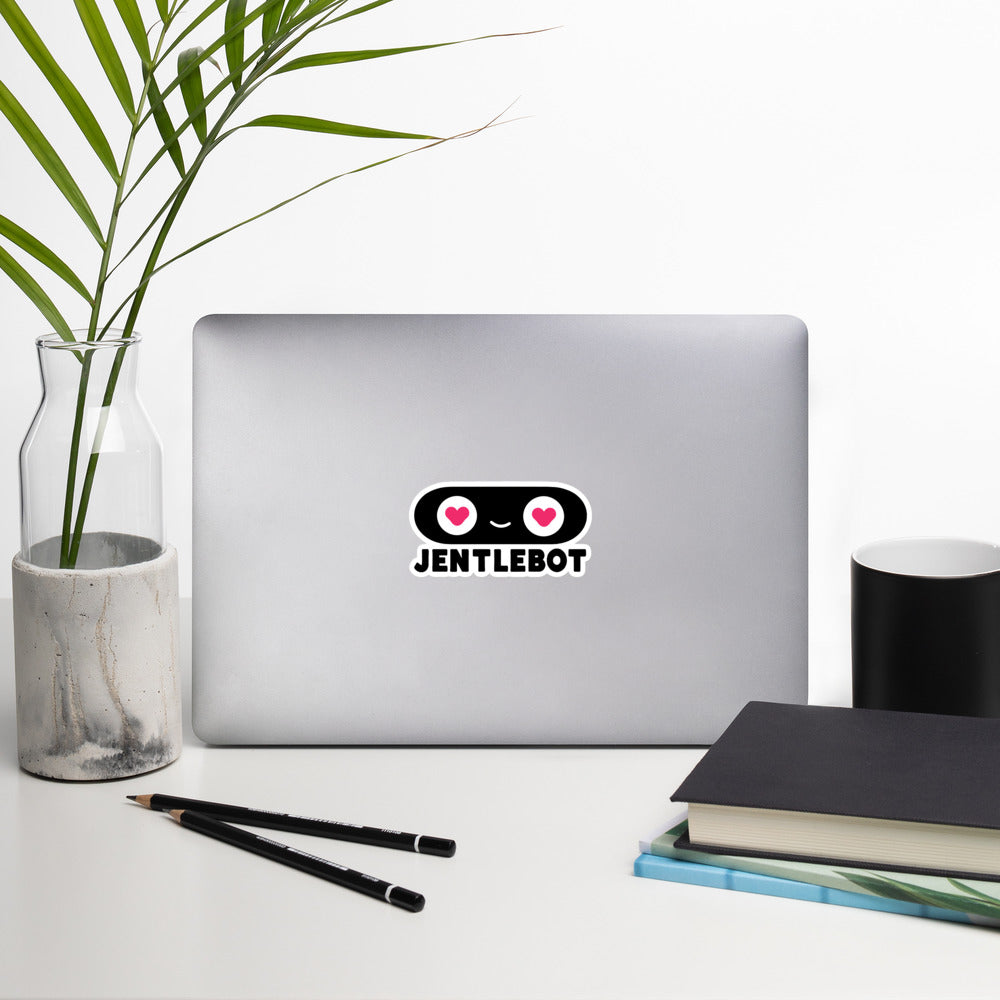 Laptop with a unique design on a desk with a plant, mug, and books.