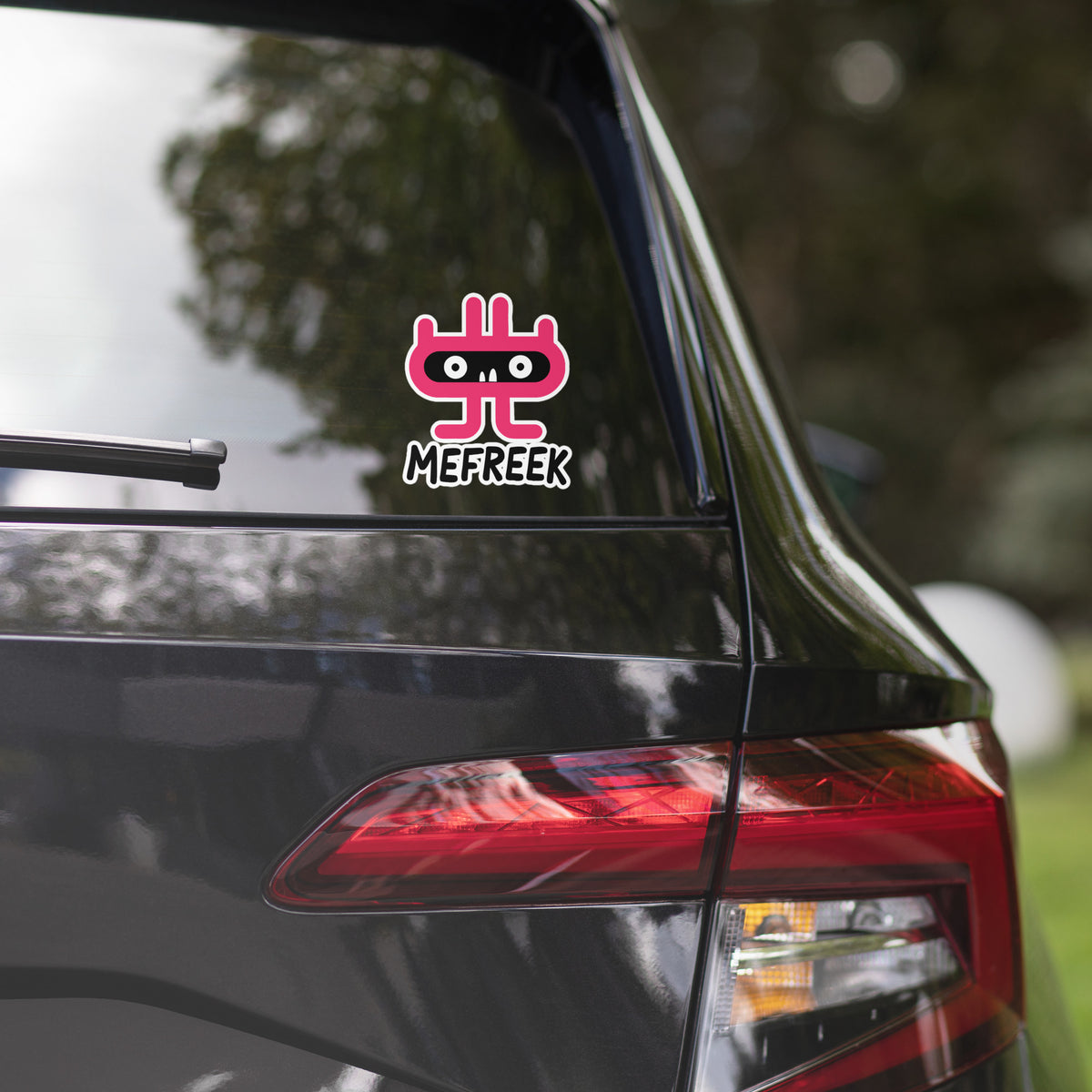 Car with a Mefreek sticker on the back window