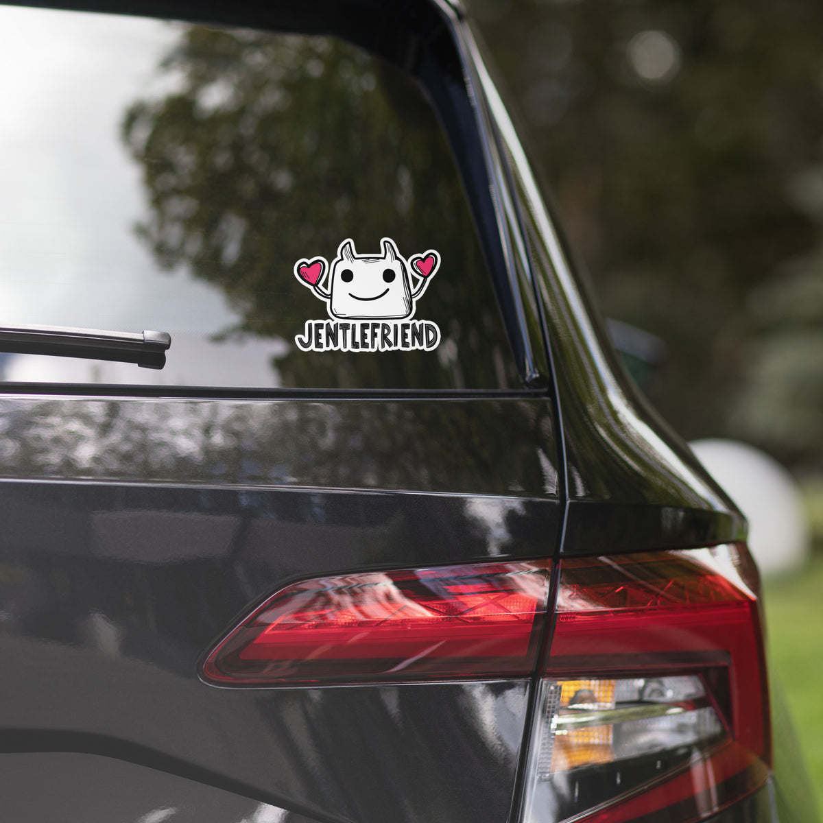 Car sticker on a car's rear window with Arabic text and graphics.
