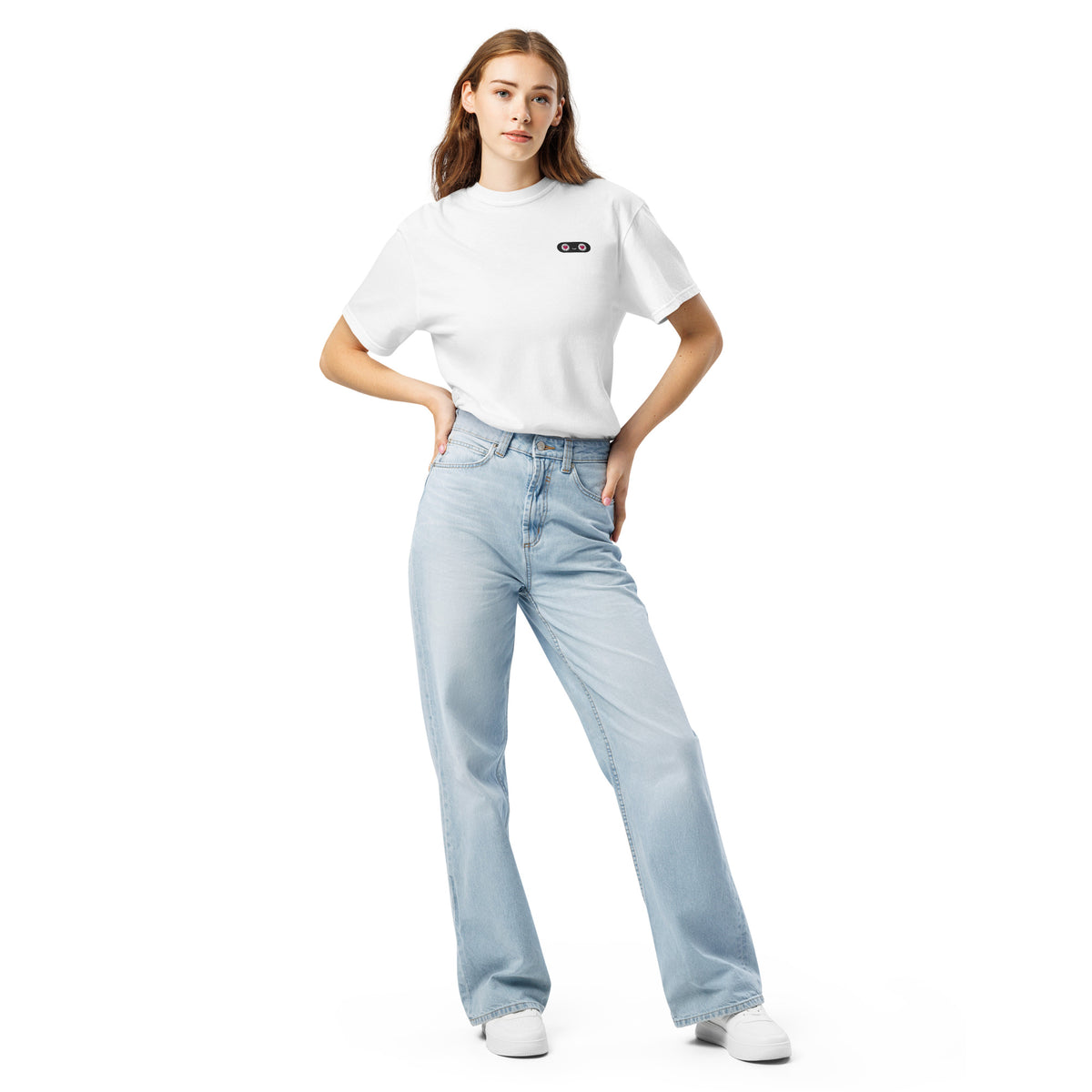 Woman wearing a white t-shirt and light blue jeans on a white background
