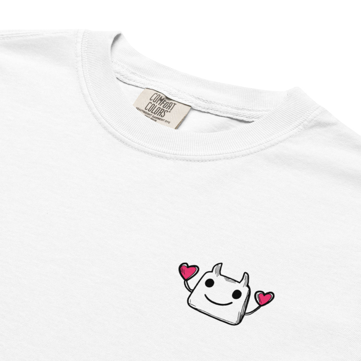 White t-shirt with a cartoon character and hearts on a white background